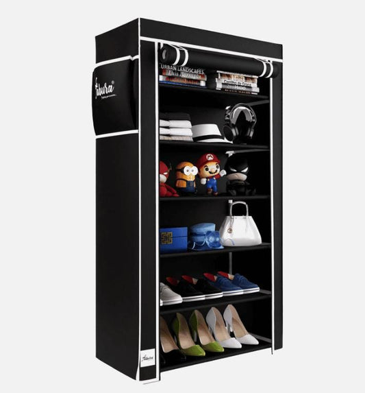 Black shoe cabinet with various items on a white background